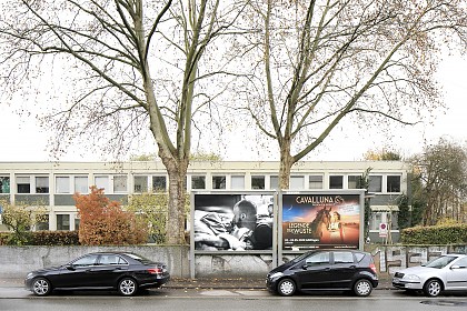 Photographies by Nancy Borowick on billboards in the city of Kassel