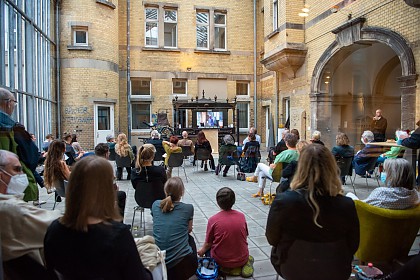 The event was broadcast live to the courtyard so that more people could attend the opening under the applicable distance rules.